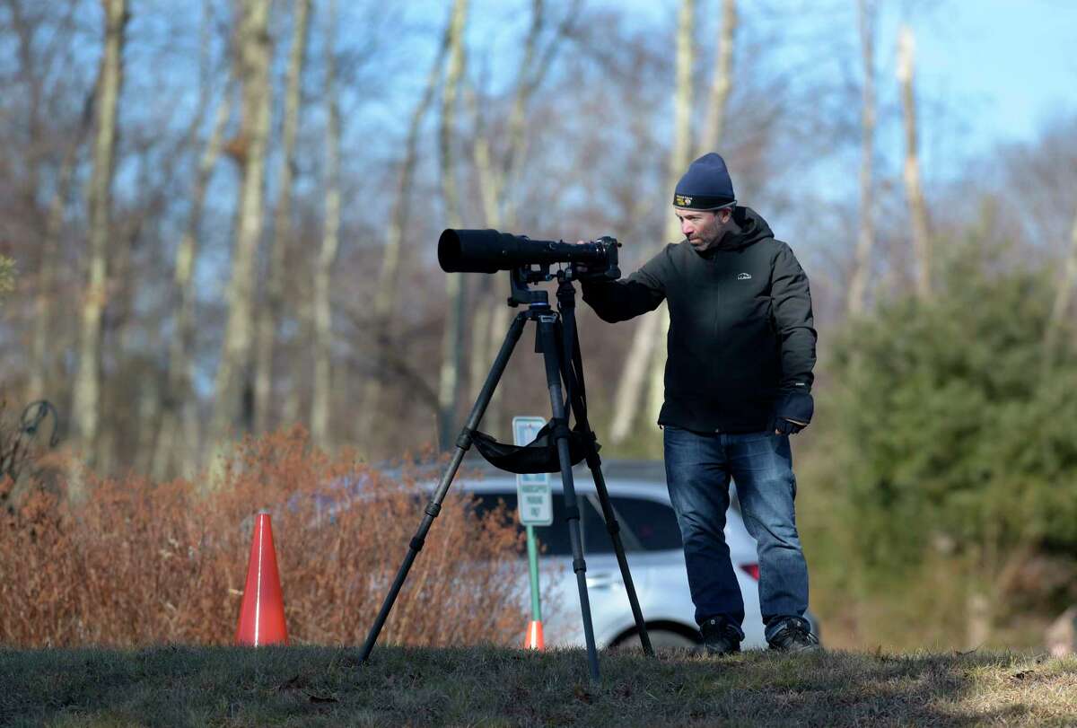 Mike Burke, of Southbury, uses a nice setup to capture images of bald eagles at the Shepaug Eagle Observatory on Wednesday, Jan. 3, 2024, in Southbury, Conn. The observatory is now open for its 38th season, offering residents a unique opportunity to view bald eagles in their natural habitat. The observatory is run by FirstLight, which owns and operates the Shepaug Hydro Generating Station in Southbury.
