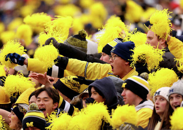 Michigan Wolverines fans cheer during the second half in the game between the Ohio State Buckeyes and the Michigan Wolverines at Michigan Stadium on Nov. 25, 2023 in Ann Arbor, Mich.