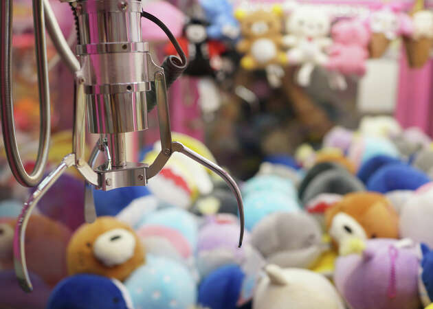 A claw inside a claw machine.