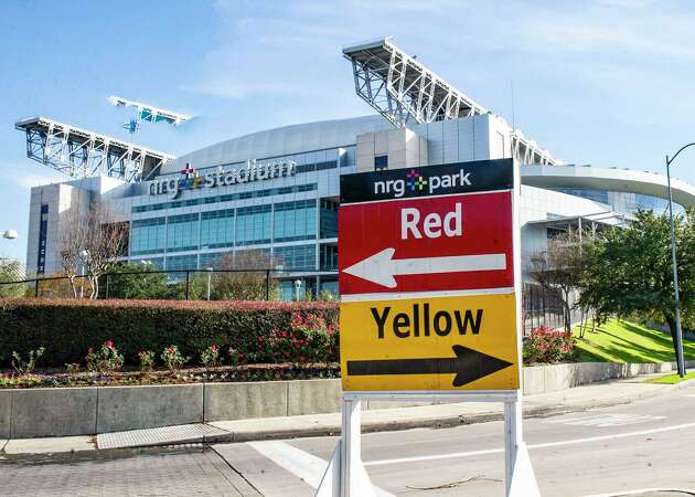 Signs direct fans to available parking during the 2024 College Football Playoff National Championship game at NRG stadium in Houston.