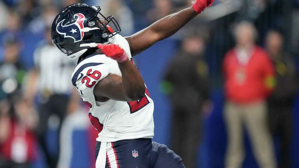 Houston Texans running back Devin Singletary (26) reacts after scoring a 3-yard touchdown to take a 23-17 lead during the second half of an NFL football game Saturday, Jan. 6, 2024, in Indianapolis.