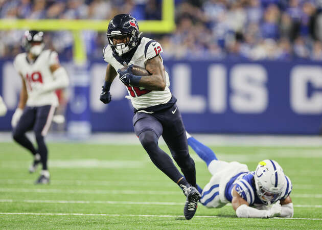 JANUARY 06: Nico Collins #12 of the Houston Texans runs with the ball during the second quarter against the Indianapolis Colts at Lucas Oil Stadium on January 06, 2024 in Indianapolis, Indiana.