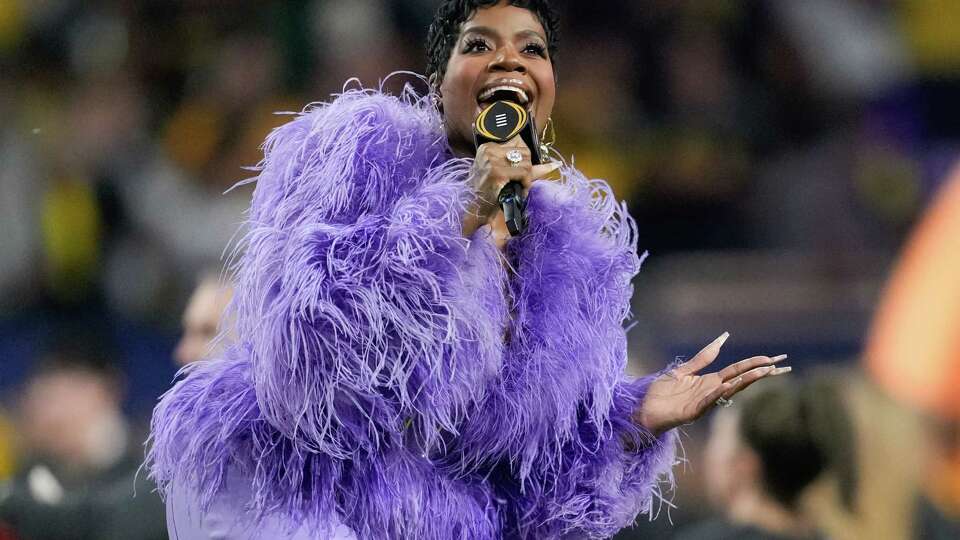 Fantasia Monique Barrino-Taylor sings the national anthem before the national championship NCAA College Football Playoff game at NRG Stadium, Monday, Jan. 8, 2024, in Houston.