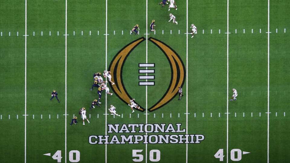 Michigan Wolverines quarterback J.J. McCarthy (9) drops back to pass during the national championship NCAA College Football Playoff game at NRG Stadium, Monday, Jan. 8, 2024, in Houston.