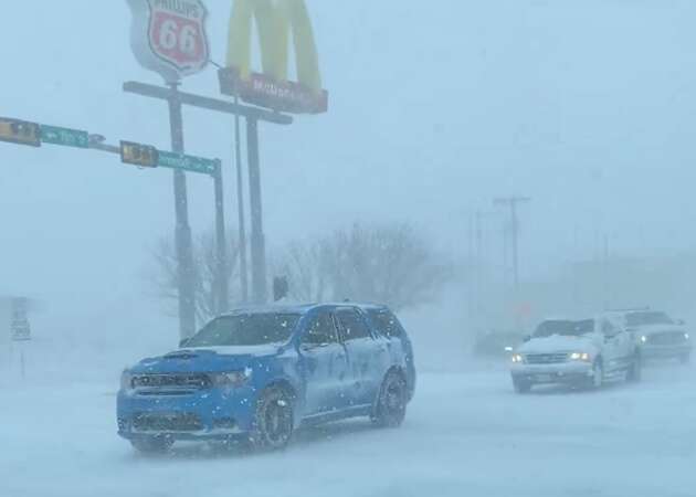 Portions of the Texas panhandle were blanketed with snow Monday as a winter storm rolled through the region, snarling traffic and blotting out visibility on roads.