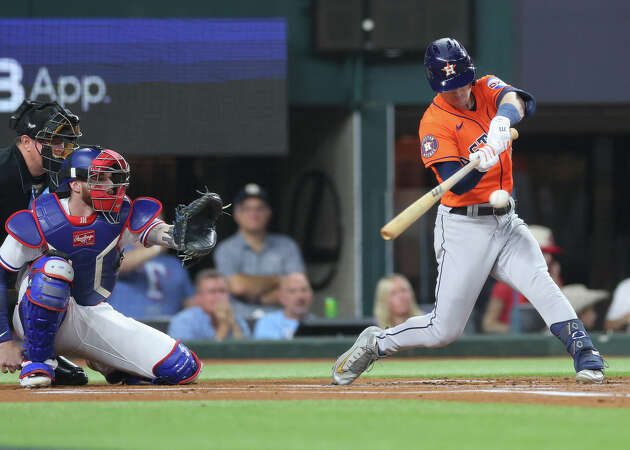 Alex Bregman #2 of the Houston Astros hits a triple in the first inning against the Texas Rangers during Game Four of the Championship Series at Globe Life Field on October 19, 2023 in Arlington, Texas.