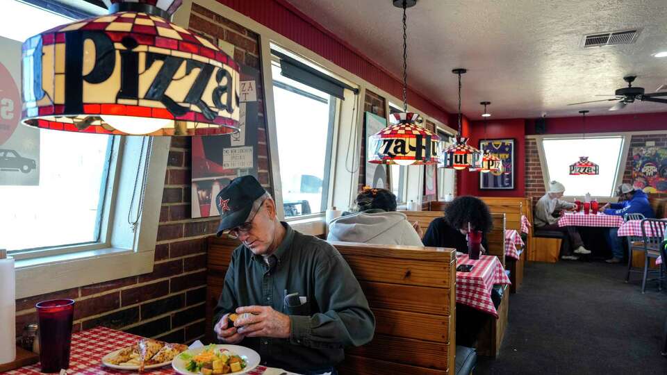 Gil Weber sits down for lunch at the dine-in Pizza Hut on Wednesday, Jan. 10, 2024 in Hempstead. The Hempstead Pizza Hut is one of the few remaining old-school dine-in locations with a buffet and the nostalgic decor.