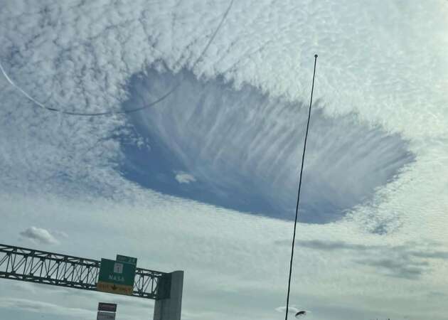 Mysterious holes opened up in the clouds over Houston on Wednesday, leaving several residents confused over the phenomenon. 