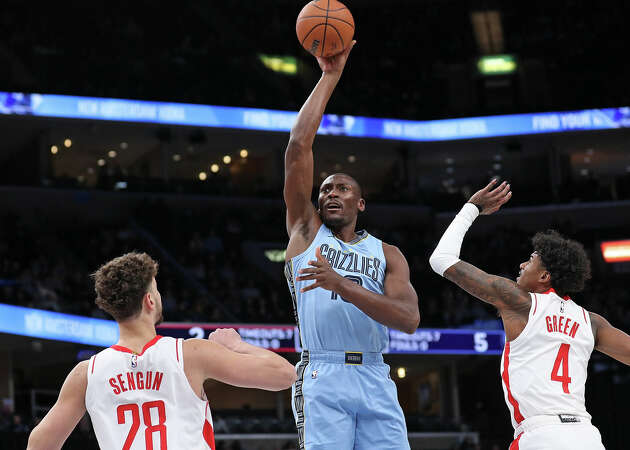 Bismack Biyombo #18 of the Memphis Grizzlies shoots against Alperen Sengun #28 of the Houston Rockets during the first half at FedExForum on December 15, 2023 in Memphis, Tennessee