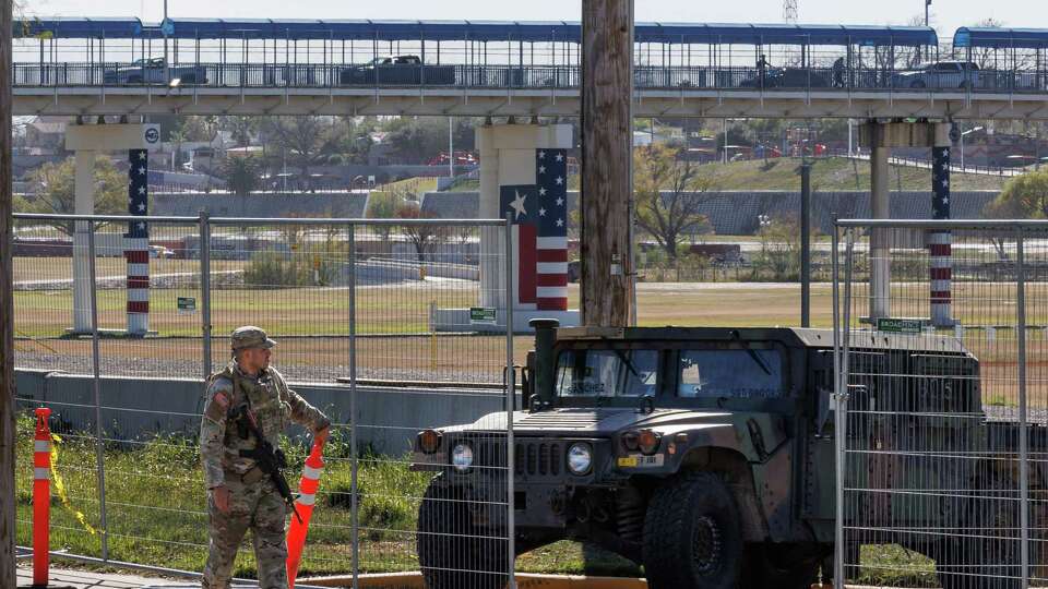 Texas Department of Public Safety officers guard an entrance to Shelby Park on Thursday, Jan. 11, 2024, in Eagle Pass, Texas. Gov. Greg Abbott signed an emergency declaration allowing state troopers to take over the park, located on the banks of the Rio Grande, without permission from the city of Eagle Pass, according to its Mayor Rolando Salinas.