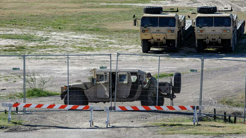 A Texas Department of Public Safety officer guards an entrance to Shelby Park on Thursday, Jan. 11, 2024, in Eagle Pass, Texas. Gov. Greg Abbott signed an emergency declaration allowing state troopers to take over the park, located on the banks of the Rio Grande, without permission from the city of Eagle Pass, according to its Mayor Rolando Salinas.