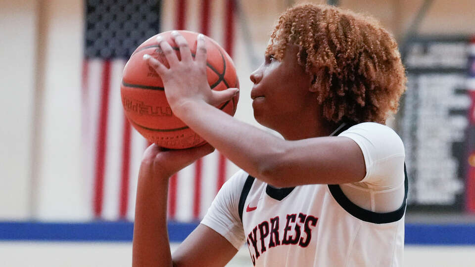 Cypress Springs shooting guard Ayla McDowell (2) shoots a 3-pointer during the first half of a District 16-6A high school basketball game at Cypress Springs High School, Tuesday, Dec. 19, 2023, in Cypress.