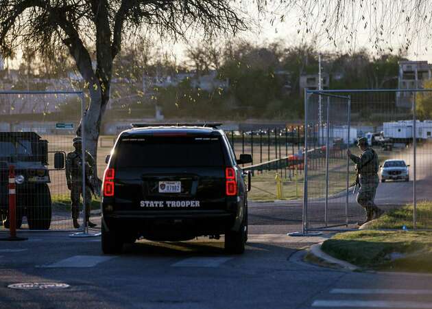 Texas Department of Public Safety officers guard an entrance to Shelby Park on Thursday, Jan. 11, 2024, in Eagle Pass, Texas. Gov. Greg Abbott signed an emergency declaration allowing state troopers to take over the park, located on the banks of the Rio Grande, without permission from the city of Eagle Pass, according to its Mayor Rolando Salinas.