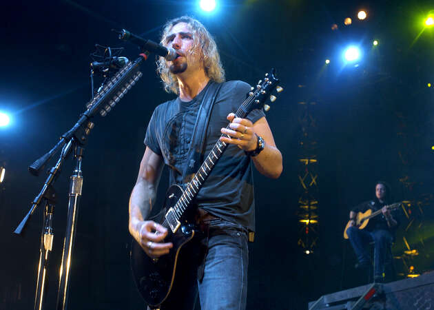 Chad Kroeger fronts Nickelback during their concert Friday, July 30, 2004, in The Woodlands, Texas. (Photo by Brett Coomer/Special to the Chronicle) 