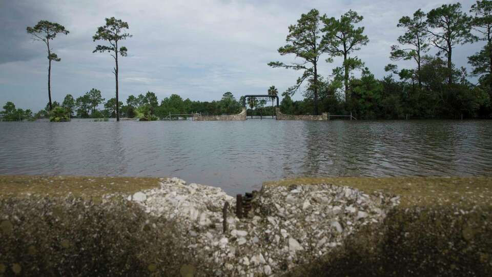 The flood water from Tropical Depression Imelda stands still on the westbound of Interstate Highway 10 on Friday, Sept. 20, 2019, in Winnie. I-10 remains closed between Texas Highway 61 and Winnie. The north side of the highway is still under deep water, like the Devilliers' ranch.