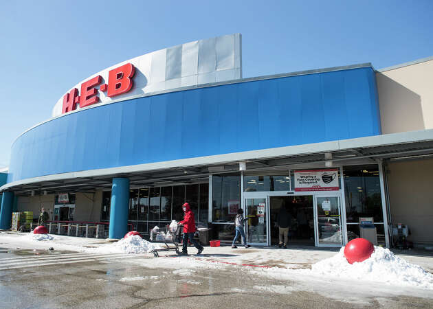 H-E-B customers leave a store in Spring as they load up on supplies Tuesday, Feb. 16, 2021 in Spring following a frigid winter storm. Temperatures stayed below freezing Tuesday and roads remained icy forcing detours on a number of roads throughout the city. More cold temperatures and possible freezing rain are forecast the next few days. (Photo by Brett Coomer/Houston Chronicle via Getty Images)