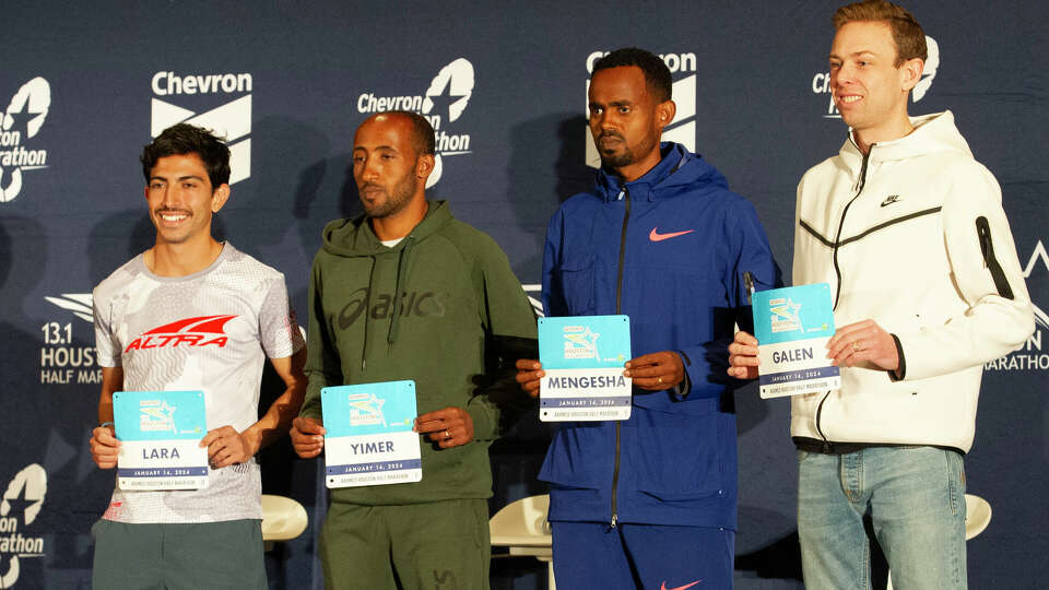 Houston news and sports anchor Greg Bailey moderates as Armco Houston Half Marathon elite athletes, Frank Lara, Jemal Yimer, Milkesa Mengasha and Galen Rupp make comments and field questions during a pre-race press conference, Friday, Jan. 12, 2024, in Houston.