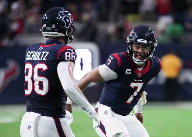 Houston Texans quarterback C.J. Stroud (7) celebrates with tight end Dalton Schultz (86) after the two connected for a 37-yard touchdown during the first half of an AFC Wild Card football game at NRG Stadium on Saturday, Jan. 13, 2024, in Houston.