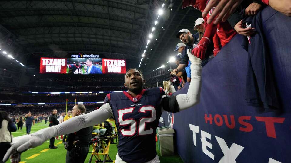 Houston Texans defensive end Jonathan Greenard (52) celebrates with fans after defeating Cleveland 45-14 during an AFC Wild Card football game at NRG Stadium on Saturday, Jan. 13, 2024, in Houston.