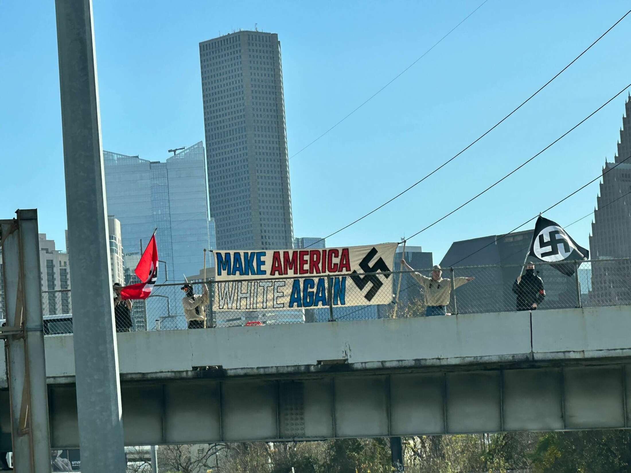 'Make America white again' banner at I-45 bridge, City Hall in Houston