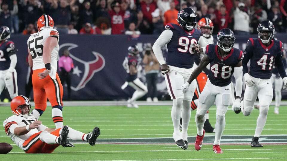 Houston Texans linebacker Christian Harris (48) celebrates after sacking Cleveland Browns quarterback Joe Flacco (15) on fourth down during the second half of an AFC Wild Card football game at NRG Stadium on Saturday, Jan. 13, 2024, in Houston.