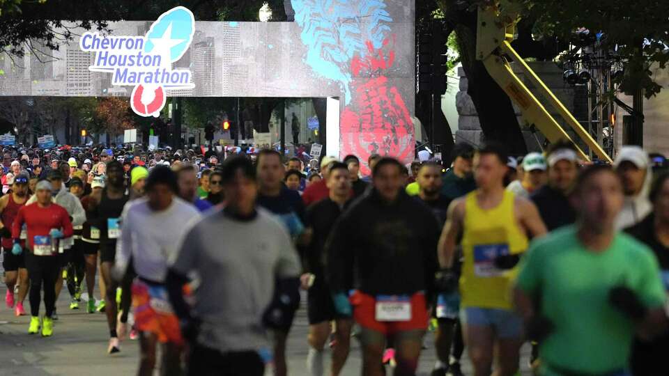 Runners take off from the start line for the Chevron Houston Marathon on Sunday, Jan. 14, 2024, in Houston.