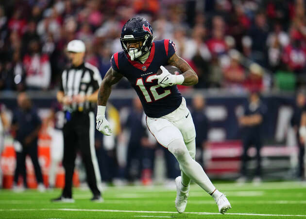 Nico Collins #12 of the Houston Texans runs with the ball against the Cleveland Browns during the first half of the AFC Wild Card playoff game at NRG Stadium on January 13, 2024 in Houston, Texas.