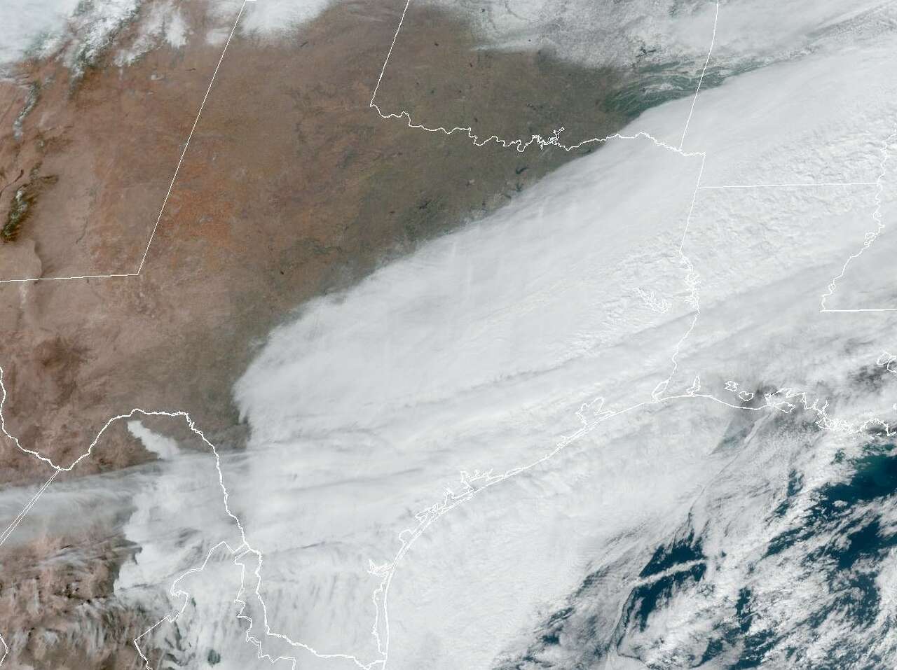 Southeast Texas remains obscured by clouds in this weather satelllite image taken at 12:30 p.m. Monday. But Tuesday's forecast calls for clearing skies as high atmospheric pressure moves into the region.