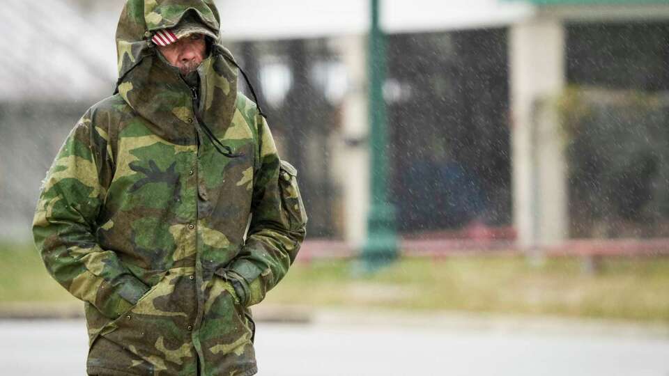 Rickey Reed bundles up as temperatures dipped below freezing as he walks to the store on Monday, Jan. 15, 2024 in Conroe.