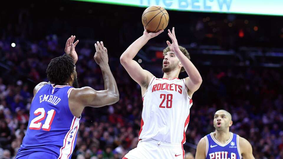 PHILADELPHIA, PENNSYLVANIA - JANUARY 15: Alperen Sengun #28 of the Houston Rockets shoots over Joel Embiid #21 of the Philadelphia 76ers during the second quarter at the Wells Fargo Center on January 15, 2024 in Philadelphia, Pennsylvania. NOTE TO USER: User expressly acknowledges and agrees that, by downloading and or using this photograph, User is consenting to the terms and conditions of the Getty Images License Agreement.