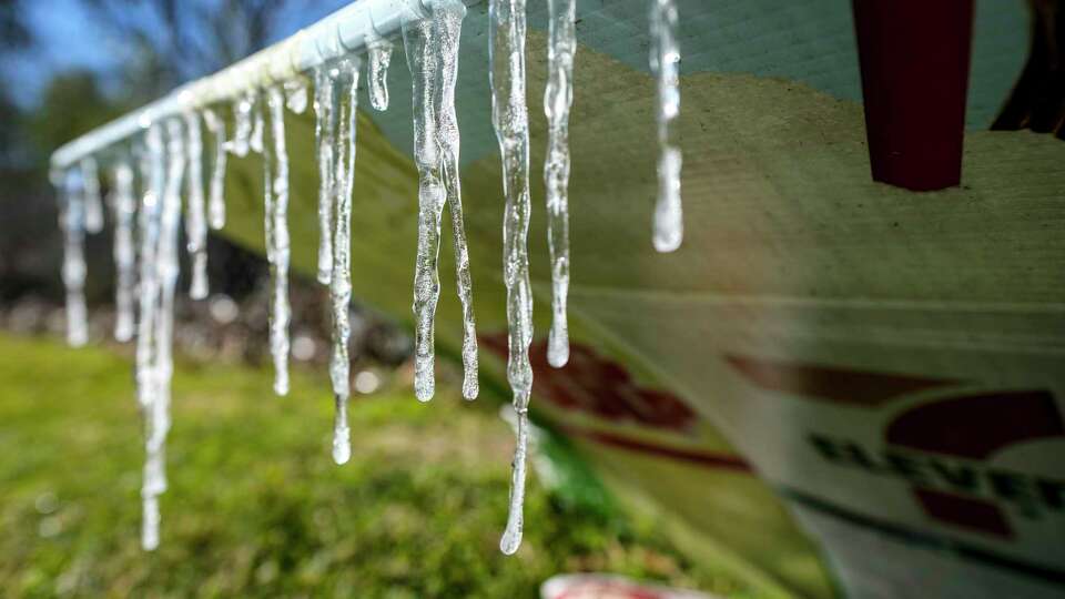 Icicles are formed on a sign at a convenience store along FM2920 on Tuesday, Jan. 16, 2024 in Spring.