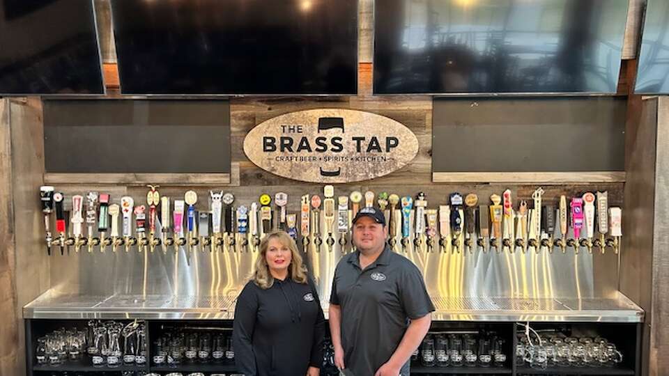 The Bumsteads will open the first of their six locations of The Brass Tap on January 22. The Brass Tap specializes in craft beers, with more than 200 varieties on hand, and sharable foods.