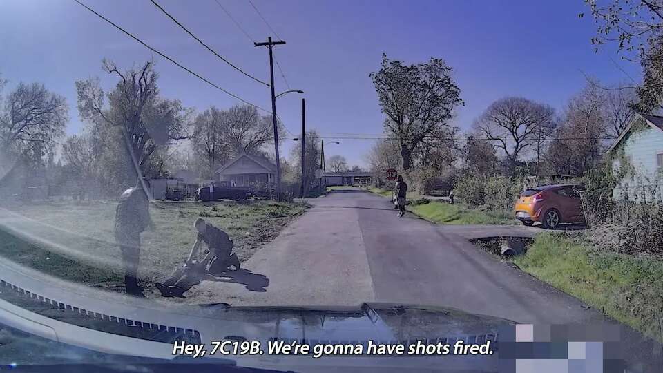 A screenshot from a police car dash camera shows officers responding to a Dec. 17, 2023 police shooting in northeast Houston. The police department on Jan. 16 said it planned to change body camera policies after the body camera of the officer who fired his gun, wounding a man, didn't record the incident on his body camera.