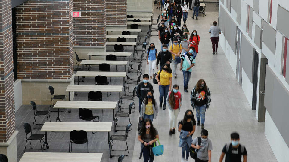 Students wear face masks while walking the hallways of Stockton Junior High School on the first day of in-person school for Conroe ISD, Tuesday, Sept. 8, 2020, in Conroe.