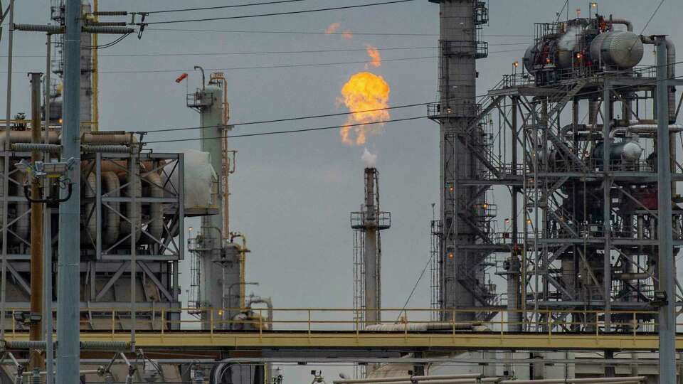 Flame is visible from the top of a flare stack at the Air Liquide plant Thursday, Jan. 18, 2023 in Pasadena.