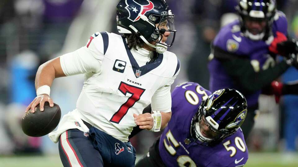 Houston Texans quarterback C.J. Stroud (7) looks down field after being flushed out of the pocked by Baltimore Ravens linebacker Kyle Van Noy (50) during the second half of an NFL divisional playoff football game at M&T Bank Stadium on Saturday, Jan. 20, 2024, in Baltimore.