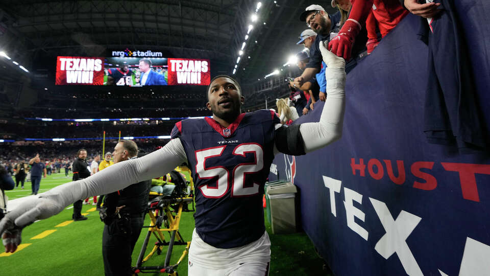 Houston Texans defensive end Jonathan Greenard (52) celebrates with fans after defeating Cleveland 45-14 during an AFC Wild Card football game at NRG Stadium on Saturday, Jan. 13, 2024, in Houston.