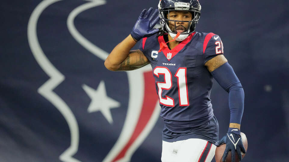 Houston Texans cornerback Steven Nelson (21) reacts after turning an interception by Cleveland Browns quarterback Joe Flacco for a 82-yard touchdown during the second half of an AFC Wild Card football game at NRG Stadium on Saturday, Jan. 13, 2024, in Houston.