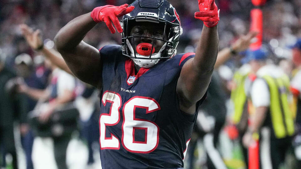 Houston Texans running back Devin Singletary (26) signals after picking up a first down during the first half of an AFC Wild Card football game at NRG Stadium on Saturday, Jan. 13, 2024, in Houston.