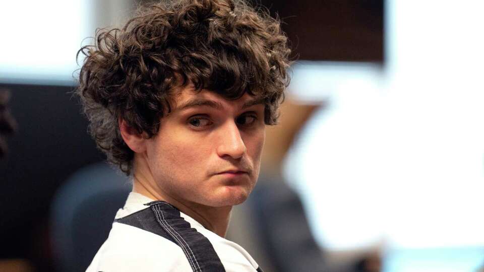 Miles Joseph Fridrich sits in a Montgomery County courtroom on Monday, Jan. 29, 2024 in Conroe. Fridrich, 24, is charged with murder in the stabbing death of Conroe pediatrician Talat Khan, 54, while she was sitting at a picnic table in her apartment complex on Oct. 29, 2023.