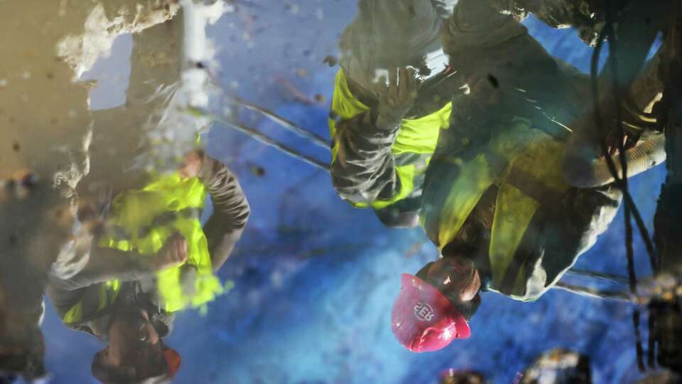 Workers with the West University Public Works repair a water line break at Buffalo Speedway and West Holcombe Boulevard, Wednesday, Jan. 17, 2024, in West University.