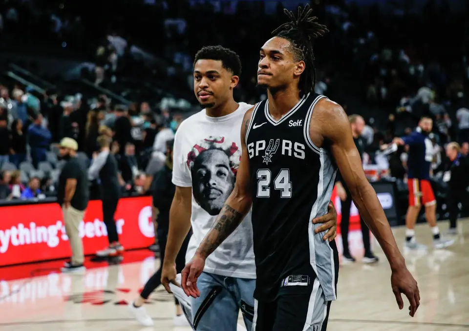 San Antonio Spurs forward Keldon Johnson consoles guard Devin Vassell (24) as they walk off the court following a 114-113 loss to the New Orleans Pelicans at Frost Bank Center on Friday, Feb. 2, 2024, in San Antonio, Texas.