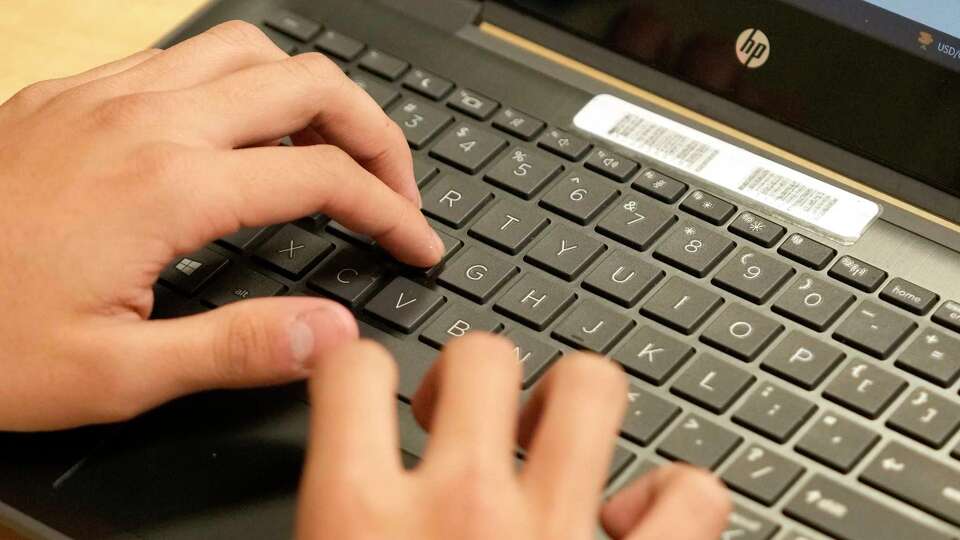 A student works on a laptop in a classroom at Kashmere High School, 6900 Wileyvale Rd., Tuesday, Feb. 6, 2024, in Houston.