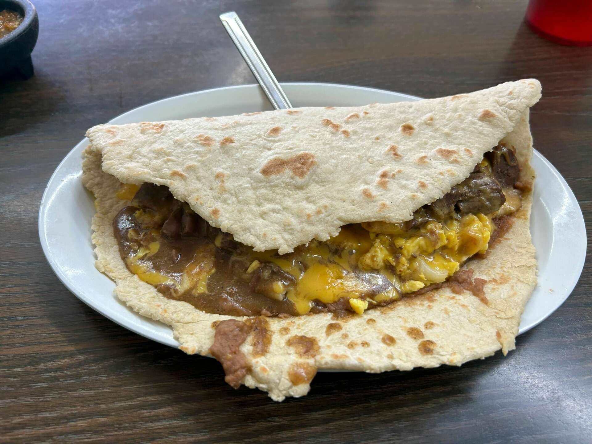 A taco the size of an iPad costs less than $10 at Rolando's