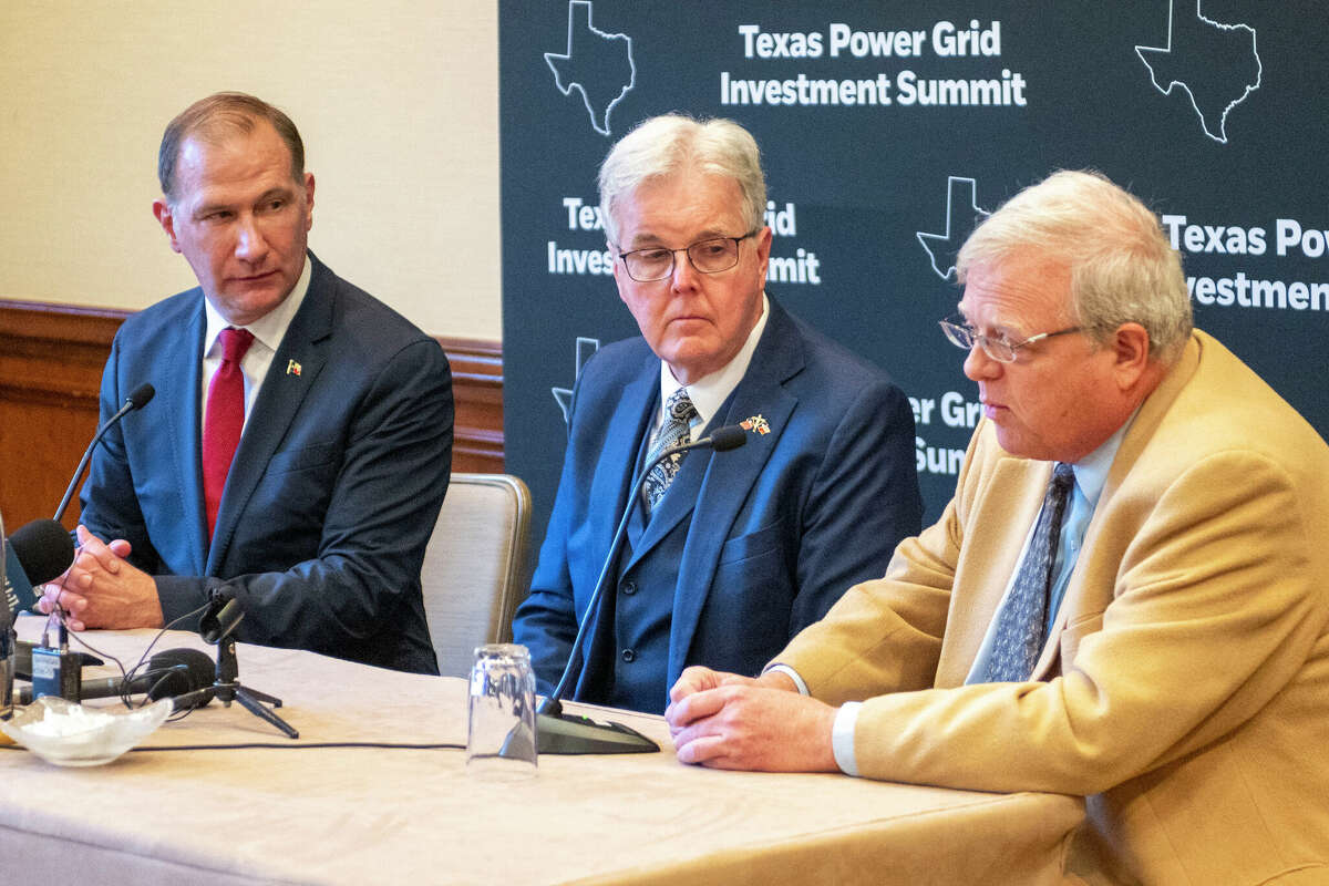 Sen. Charles Schwertner, left and Lt. Gov. Dan Patrick, center, listen as Sen. Paul Bettencourt makes a statement during a press conference at the Texas Power Grid Investment Summit, Tuesday, Feb. 6, 2024 in Houston.