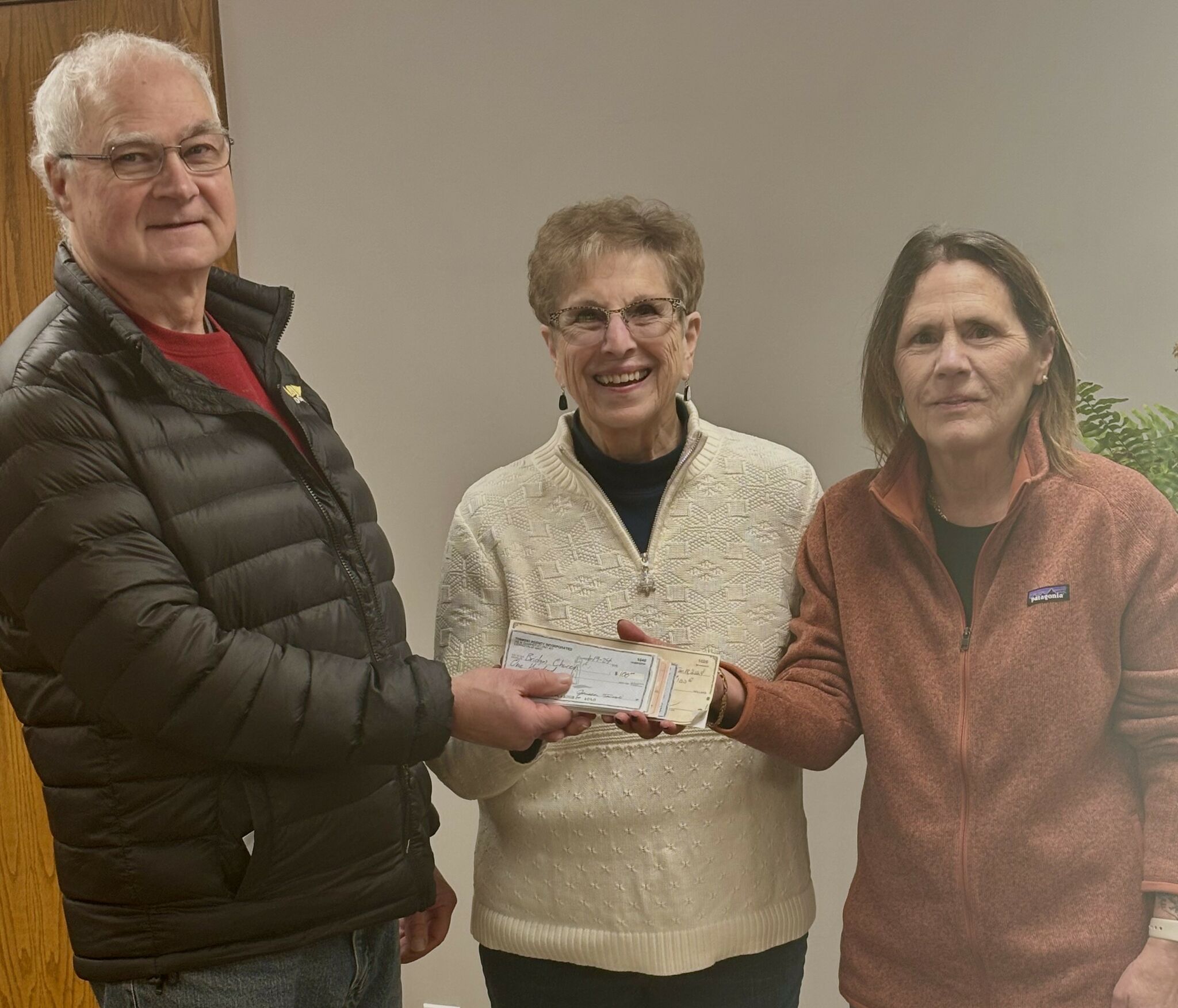 Men Who Care of Manistee donates 4,700 to Blessings in a Backpack