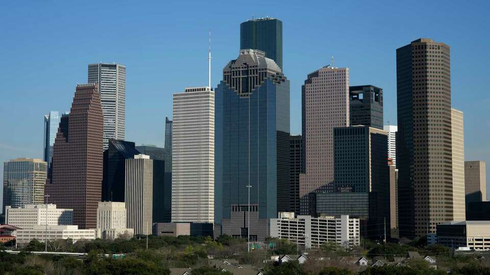 Downtown Houston skyline is photographed on Tuesday, Feb. 13, 2024 at the Thompson Hotel in Houston.