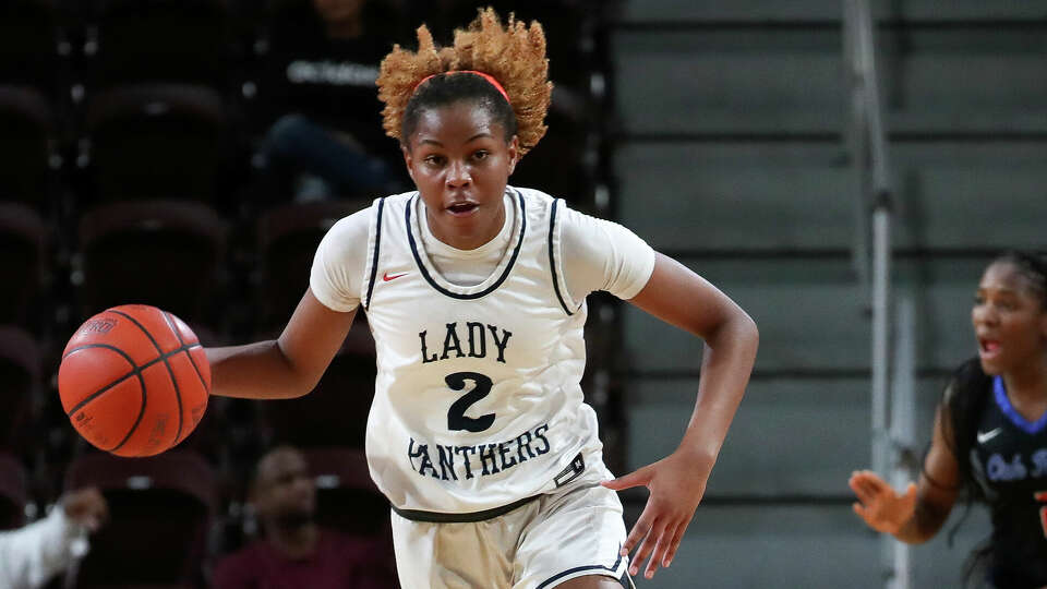 Cypress Springs shooting guard Ayla McDowell (2) drives down court during the second quarter of a Region II-6A area high school basketball playoff game at the M.O Campbell Center, Friday, Feb. 17, 2023, in Houston.