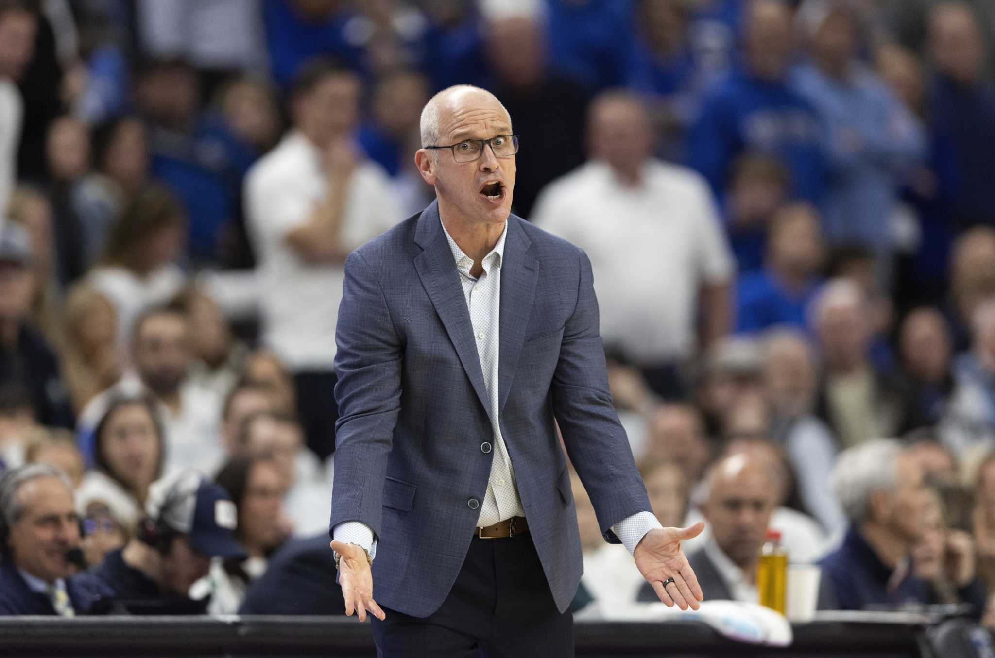 UConn men's basketball coach Dan Hurley engages with fans after loss