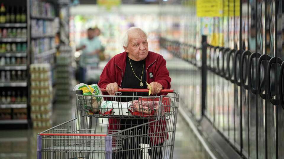 Bob Livingston shops during a grand opening event Wednesday, Feb. 21, 2024, at a new HEB store in Katy.